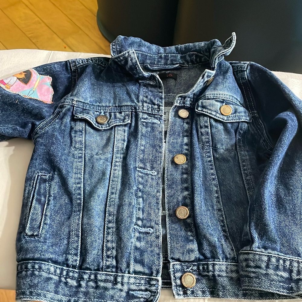 Embellished kids denim jacket size 5/6. Dora on the rt sleeve. Dream big Dreams